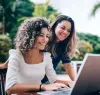 Two women on a laptop