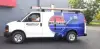 Man driving an Empire Heating & Air Conditioning van.