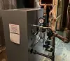 A water heater in a basement.