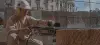 construction worker using chainsaw on stone