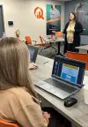 NOCO working at desk