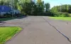 A paved parking lot in front of a Girl Scouts building