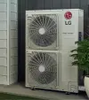two outdoor LG Smart Inverter AC units placed on a gravel surface