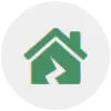 Green house icon with a zigzag line through the center on a white circular background.