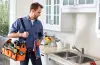 plumber carrying equipment