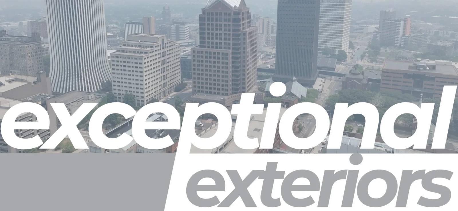 Gray and white Exceptional Exteriors logo with the Rochester skyline in the background.